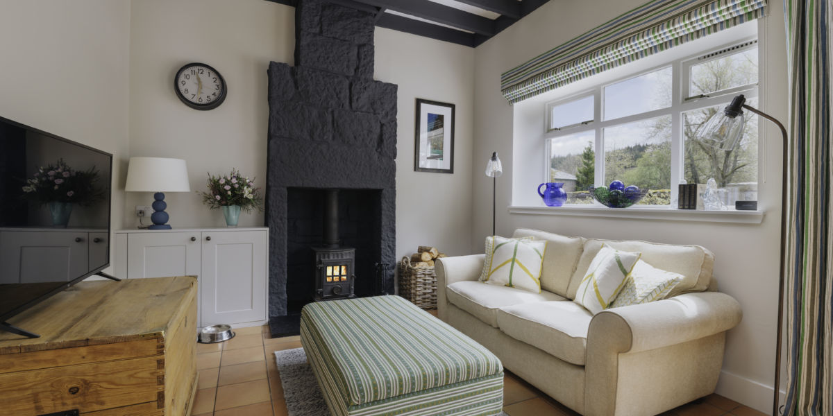 A cosy lounge with wood burning stove
